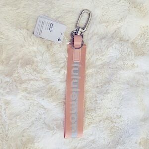 NWT Lululemon Neverlost Keychain, Pink Mist/Silver Wordmark with Silver hardware